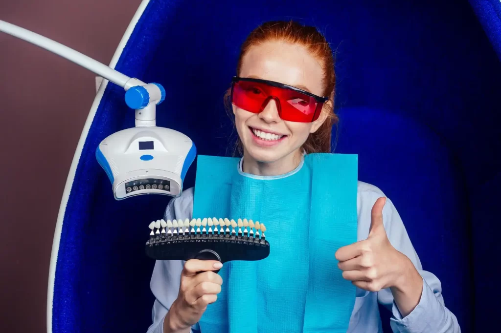 A lady posing at the dentist with laminate veneers palette 